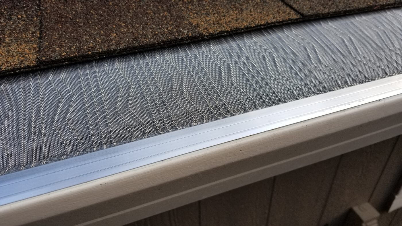 Complete Gutter Guards Guide: Types, DIY vs Pro Installation Costs & Clog Prevention
